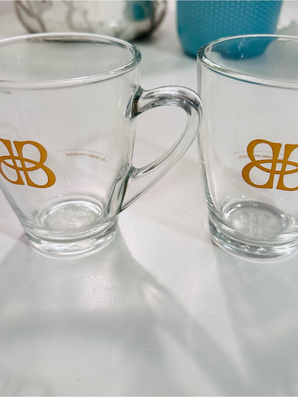 Belies Clear Glass Mugs with Gold Logo - Set of 2